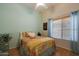 Cozy bedroom with soft colors, a ceiling fan, and a window providing natural light at 16546 E Ashbrook Dr # A, Fountain Hills, AZ 85268