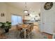 Bright dining area with a charming table set and an open flow to the kitchen at 16546 E Ashbrook Dr # A, Fountain Hills, AZ 85268