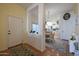 Entryway with view of dining and kitchen with wood flooring and natural light at 16546 E Ashbrook Dr # A, Fountain Hills, AZ 85268