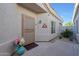 Inviting entryway with a secure screen door, desert landscaping, and warm details at 16546 E Ashbrook Dr # A, Fountain Hills, AZ 85268