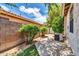 Private backyard with lush greenery, a block wall, and ample space for outdoor enjoyment at 17620 W Weatherby Dr, Surprise, AZ 85374