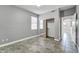 Bright bedroom with a large window, mirrored closet, and neutral color palette at 17620 W Weatherby Dr, Surprise, AZ 85374