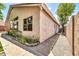 Exterior corner view of the home showcasing stucco and a gravel side yard at 17620 W Weatherby Dr, Surprise, AZ 85374