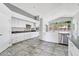 Bright kitchen featuring modern appliances, granite countertops, and an adjacent dining area at 17620 W Weatherby Dr, Surprise, AZ 85374