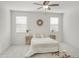 Bright, minimalist bedroom with neutral tones, decorative accents, and ample natural light at 18465 W Fulton St, Goodyear, AZ 85338