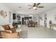 Spacious living room leading to an open kitchen and dining area, perfect for entertaining at 18465 W Fulton St, Goodyear, AZ 85338