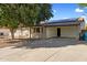 Well-maintained single-story brick home with a covered carport and easy access driveway on a clear day at 2136 W Sharon Ave, Phoenix, AZ 85029