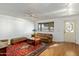 Bright living room with hardwood floors, neutral walls, and an inviting seating arrangement at 2136 W Sharon Ave, Phoenix, AZ 85029