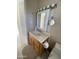 Bathroom featuring a light wood vanity, sink, and toilet at 2315 S Seminole Dr, Apache Junction, AZ 85119