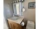 Cozy bathroom featuring a wood vanity, framed mirror, and standard toilet at 2315 S Seminole Dr, Apache Junction, AZ 85119