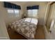 Bedroom with wooden floors, mirrored closet, and blue curtains at 2315 S Seminole Dr, Apache Junction, AZ 85119