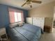 Bedroom features a ceiling fan and a pair of white dressers at 2315 S Seminole Dr, Apache Junction, AZ 85119