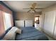 Bright bedroom features two white dressers, ceiling fan, and a glimpse into the dining area at 2315 S Seminole Dr, Apache Junction, AZ 85119