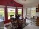 Cozy dining area with a wooden table, chairs, and three windows allowing for ample natural light at 2315 S Seminole Dr, Apache Junction, AZ 85119