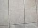 Close up detail of neutral ceramic floor tiles with light grout lines at 2315 S Seminole Dr, Apache Junction, AZ 85119