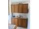 Close-up view of kitchen cabinetry with decorative elements and neutral backsplash at 2315 S Seminole Dr, Apache Junction, AZ 85119