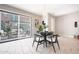 Dining area with sliding glass doors to a private patio, chandelier and modern decor at 240 W Missouri Ave # 13, Phoenix, AZ 85013