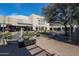 Exterior shot of an outdoor plaza with water feature and landscaped flower beds at 240 W Missouri Ave # 13, Phoenix, AZ 85013