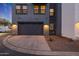 Modern townhouse featuring an attached garage, contemporary design, and beautiful landscaping at 240 W Missouri Ave # 13, Phoenix, AZ 85013