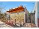 Exterior shot of a cafe featuring patio seating and unique metal screen at 240 W Missouri Ave # 13, Phoenix, AZ 85013