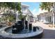 Outdoor fountain in a shopping area with visible storefronts and landscaping at 240 W Missouri Ave # 13, Phoenix, AZ 85013