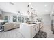 Bright kitchen features a large island with sink, pendant lighting, and open floor plan with sliding patio doors at 240 W Missouri Ave # 13, Phoenix, AZ 85013