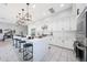 Spacious kitchen with a large island, modern lighting, stainless steel appliances, and ample cabinet space at 240 W Missouri Ave # 13, Phoenix, AZ 85013