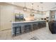 Bright and open kitchen with an island and barstools, featuring modern appliances and clean lines at 240 W Missouri Ave # 13, Phoenix, AZ 85013