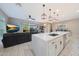 Contemporary kitchen with an island and bar seating, blending seamlessly into the living space at 240 W Missouri Ave # 13, Phoenix, AZ 85013