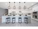 Modern kitchen with pendant lighting, stainless steel appliances, and a large island with seating at 240 W Missouri Ave # 13, Phoenix, AZ 85013