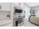 Close up of a stainless steel oven and microwave combo in an open concept living space at 240 W Missouri Ave # 13, Phoenix, AZ 85013