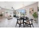 Open living space with dining area, living room with modern decor, and sliding glass door to outdoor patio at 240 W Missouri Ave # 13, Phoenix, AZ 85013
