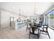 Open concept living space with a large kitchen island, dining area, and living room at 240 W Missouri Ave # 13, Phoenix, AZ 85013
