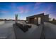 Relaxing rooftop with gray wicker sofa, ottoman, and sunset views at 240 W Missouri Ave # 13, Phoenix, AZ 85013