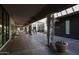 Outdoor mall walkway with stores, potted plants, and people walking at 240 W Missouri Ave # 13, Phoenix, AZ 85013