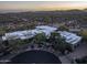 Aerial view of property showcasing modern architecture, desert landscaping, and a circular driveway at 25002 N Quail Haven Dr, Rio Verde, AZ 85263