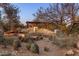 Backyard with desert landscaping, and a pergola-covered area, designed for relaxing and outdoor enjoyment at 25002 N Quail Haven Dr, Rio Verde, AZ 85263