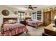 Charming bedroom with two beds, southwest decor, and wood-trimmed windows at 25002 N Quail Haven Dr, Rio Verde, AZ 85263