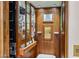 Interior view of a unique residential elevator with wood paneling, custom art, and convenient access at 25002 N Quail Haven Dr, Rio Verde, AZ 85263