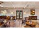 Charming living room showcasing wood beam ceilings and terracotta flooring at 25002 N Quail Haven Dr, Rio Verde, AZ 85263