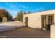 Expansive rooftop deck with serene views, neutral stucco walls, and glass doors for indoor-outdoor living at 25002 N Quail Haven Dr, Rio Verde, AZ 85263