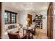 Bright sitting area with a window bench, bookshelves, and a round table at 25002 N Quail Haven Dr, Rio Verde, AZ 85263