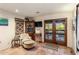 Cozy sitting room with tile floor, corner cabinet and doors to the exterior at 25002 N Quail Haven Dr, Rio Verde, AZ 85263