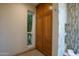 Bathroom features custom oak storage cabinetry and a window offering a tranquil view, enhancing the room's charm at 2514 E Montebello Ave, Phoenix, AZ 85016