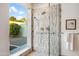 Tiled shower and window offer a bright, refreshing bathroom experience with modern fixtures and natural light at 2514 E Montebello Ave, Phoenix, AZ 85016