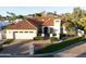 Charming front exterior view of a single-story home with a 2-car garage, landscaped yard, and mountain views at 2514 E Montebello Ave, Phoenix, AZ 85016