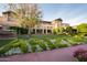 Exterior view of Arizona Biltmore Resort with landscaping, flowering trees, and architectural details at 2514 E Montebello Ave, Phoenix, AZ 85016