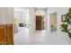 Bright foyer featuring tile floors, and a view of the living room with a fireplace at 2514 E Montebello Ave, Phoenix, AZ 85016