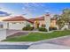 Beautiful single-story home showcasing a red tile roof, lush greenery, and warm exterior lighting at 2514 E Montebello Ave, Phoenix, AZ 85016