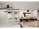 Kitchen featuring bar seating, granite counters, and stainless steel mini fridge and sink at 2514 E Montebello Ave, Phoenix, AZ 85016